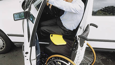 Glideboard in use, for safe seated patient transfer